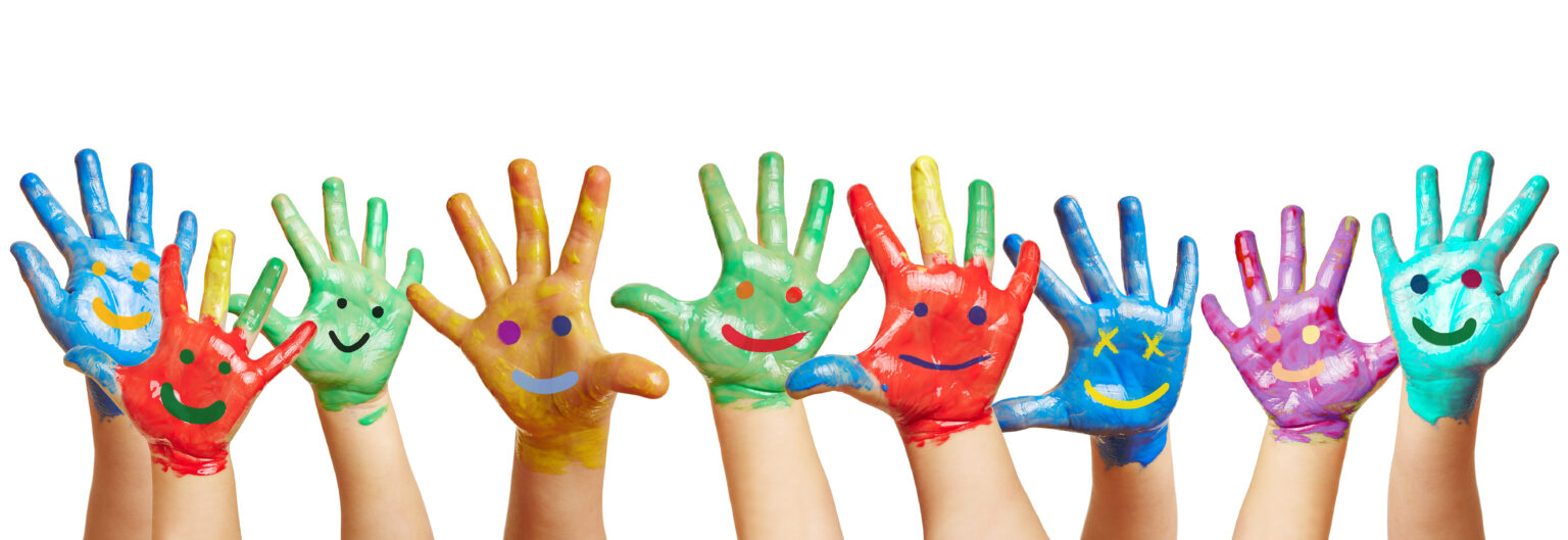 Photo of children’s hands painted with colorful happy faces